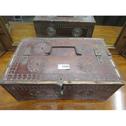 2060 - A heavily carved hardwood and metal bound table top box