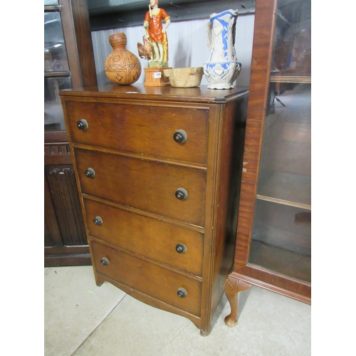 2066 - A 1950's walnut chest of four drawers with original black knobs