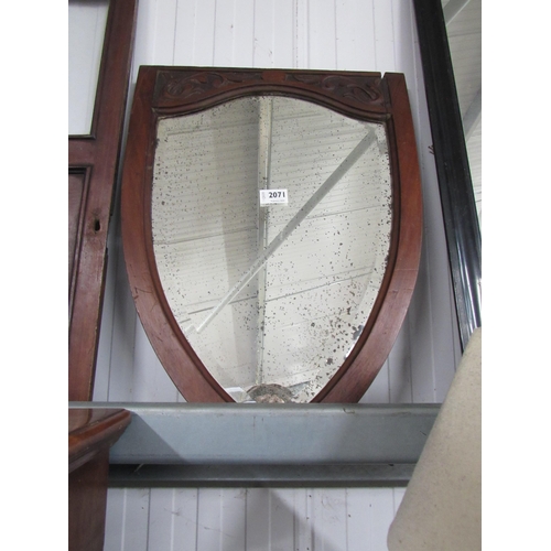 2071 - A 19th Century mahogany shield shape mirror with worn mirror plate            (R) £15