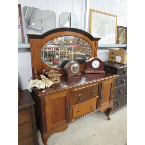 2083 - A 1930's walnut sideboard, oval mirror gallery back over two drawer and two cupboard base, cabriole ... 