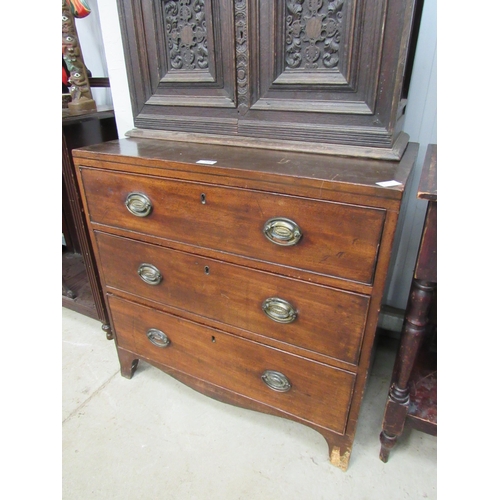 2097 - A 19th Century mahogany chest of three long drawers, brass ovel handles, on bracket feet, loss to fo... 