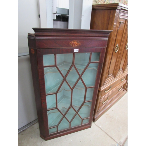 2160 - A Georgian inlaid mahogany corner cabinet, crack to glass