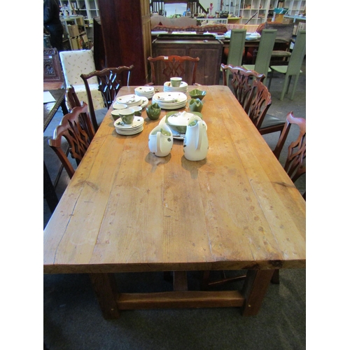 1139 - A rustic pine plank-top refectory dining table, 180.5cm x 94.5cm