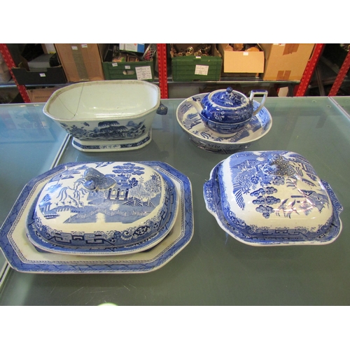 1180 - A collection of 19th Century and later blue and white ceramics including Willow pattern covered ture... 