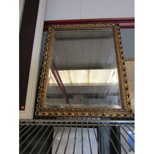 1388 - A gilt classical wall mirror of rectangular form, pierced detail, 50cm x 41cm