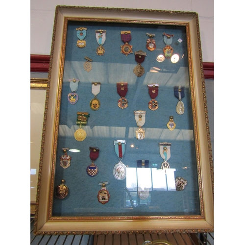 1402 - A framed collection of Masonic medals to include 