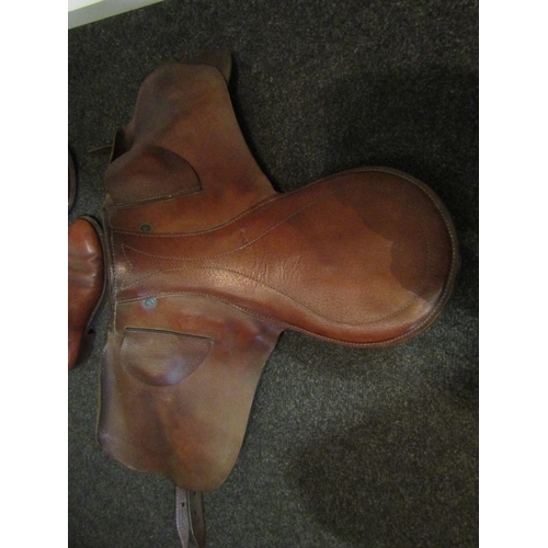 1420 - A riding saddle and boots