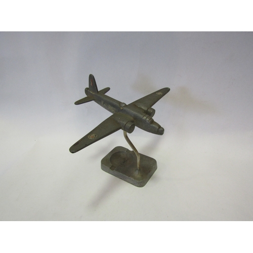 1437 - A WWII style metal aircraft model on ashtray stand