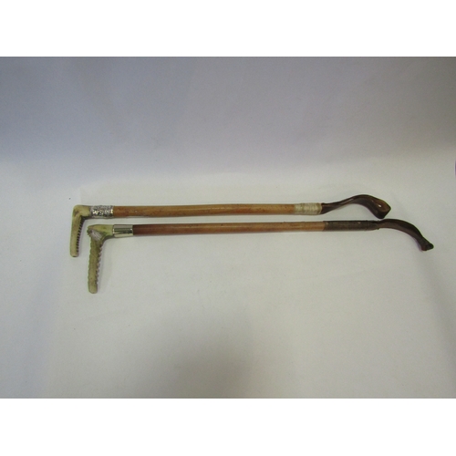 1450 - Two vintage riding crops, one with silver band