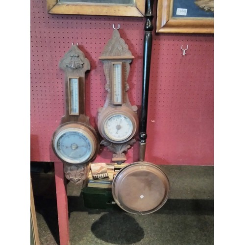 1050 - Two wall hanging barometers and a copper bed warmer