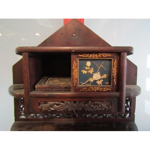 4068 - A Japanese wall hanging display shelf with floral design doors, fretwork friezes and enriched with g... 