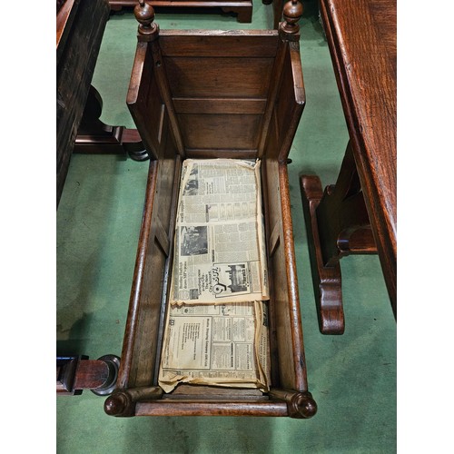 4215 - An 18th Century panelled oak cradle/log box with turned finial decoration on sledge foot end support... 