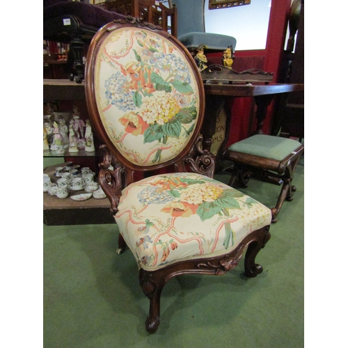 4013 - A mid Victorian carved walnut armchair with acanthus leaf and floral decoration on cabriole scroll f... 