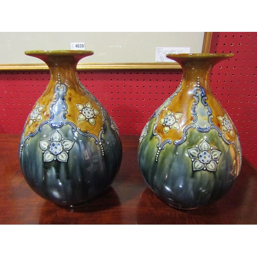 4031 - A pair of Doulton baluster form vases with flared rim, 24cm tall