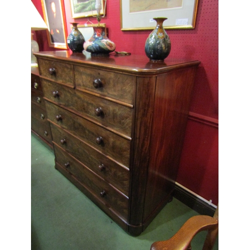 4034 - A Circa 1860 flame mahogany round cornered chest of two short over four graduating long drawers with... 