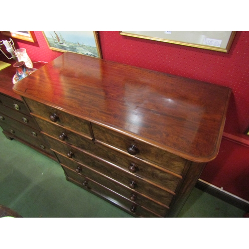 4034 - A Circa 1860 flame mahogany round cornered chest of two short over four graduating long drawers with... 