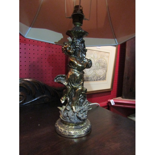 4050 - A gilt figural table lamp with shade