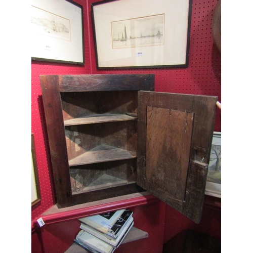 4056 - A George III mahogany and oak wall-hanging corner cabinet, 68.5cm tall x 54cm wide x 26.5cm deep