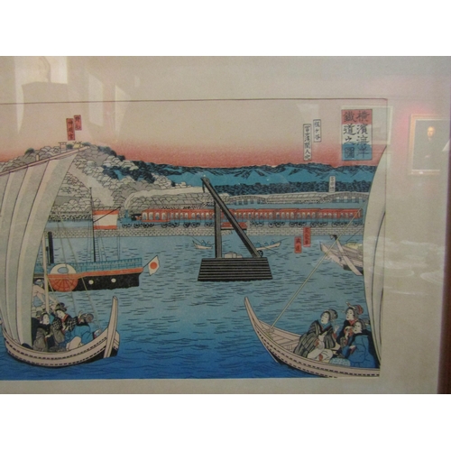 4065 - A Japanese woodblock print of ships in harbour.  Framed and glazed.  20 x 42cm image size   (R) £60