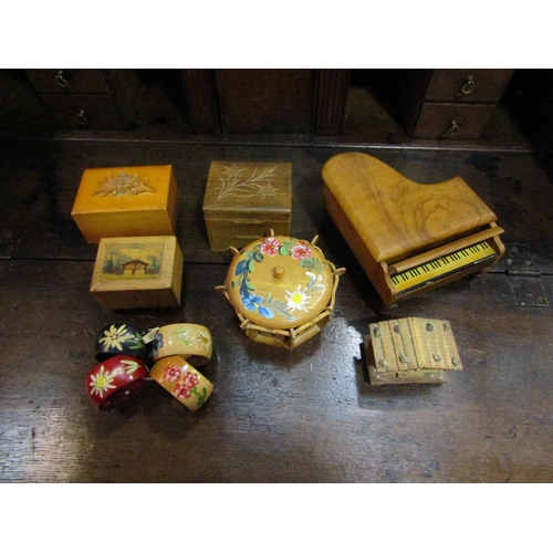 4066 - A selection of wooden Swiss musical boxes, caosters, napkin rings etc