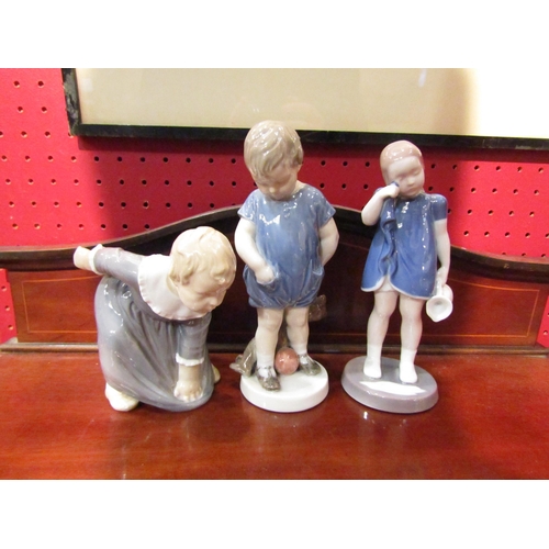 4085 - Two Royal Copenhagen figures of children and a Bing & Groenal example (3)