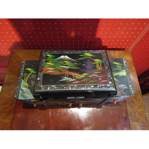 4093 - A Japanese lacqueur musical jewellery box with mount Fuji design, mirrored interiror and multiple dr... 