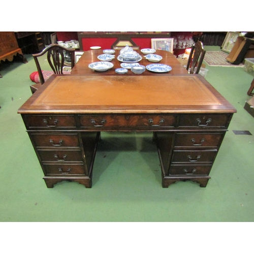 4108 - A leather topped twin pedestal eight drawer desk, 76cm tall x 134cm wide x 68cm deep