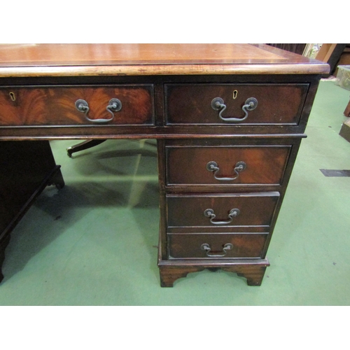 4108 - A leather topped twin pedestal eight drawer desk, 76cm tall x 134cm wide x 68cm deep