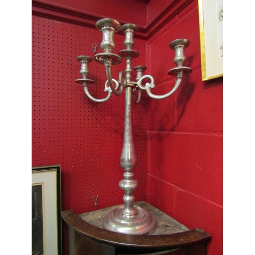 4124 - A single white metal candelabrum, 77cm tall