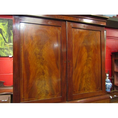 4139 - A 19th Century secretaire linen press. The cupboard top converted to a hanging space over a satin wa... 