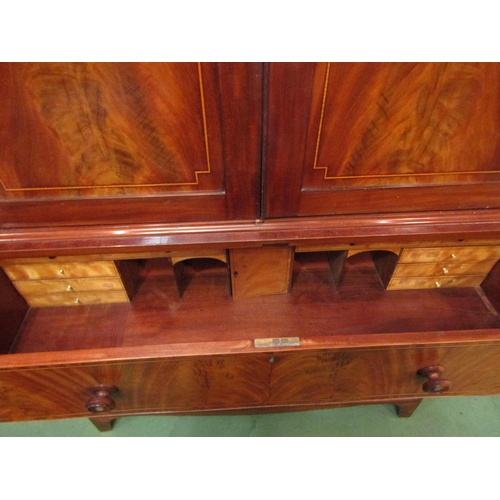 4139 - A 19th Century secretaire linen press. The cupboard top converted to a hanging space over a satin wa... 