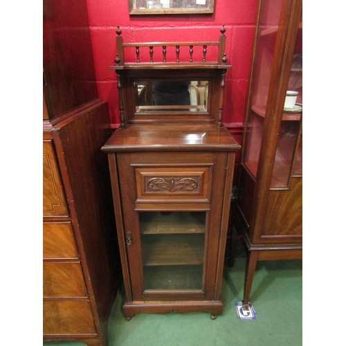 4142 - An Edwardian music cabinet on castors with bevelled mirror back and finials, 137cm tall x 51cm wide ... 