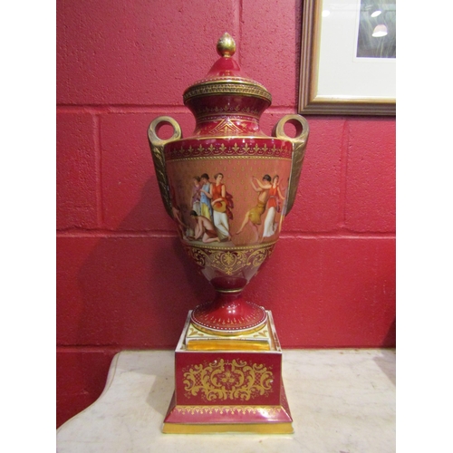 4158 - A Vienna twin handled pedestal vase with cover on square plinth, beehive mark to base, 52cm high. Co... 