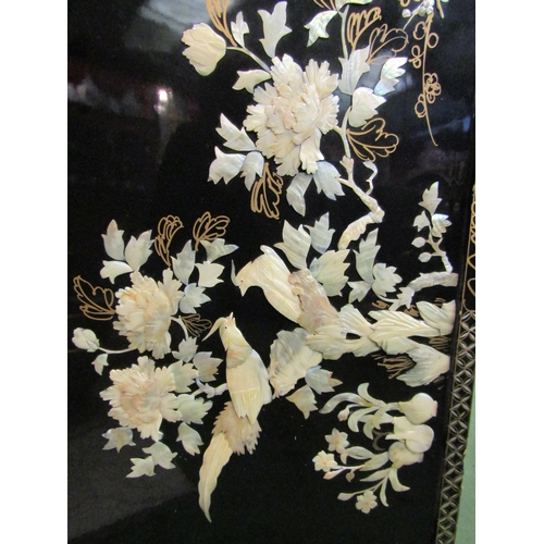 4165 - An Oriental lacquered panel with high relief mother-of-pearl detail, 50cm x 90cm