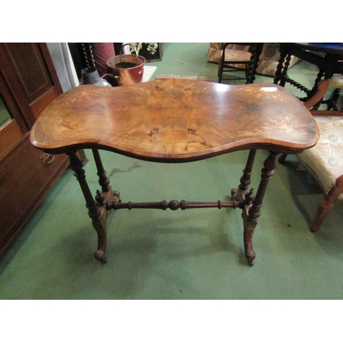 4183 - A Victorian walnut shaped top occasional table with marquetry satinwood inlay on a four column base ... 