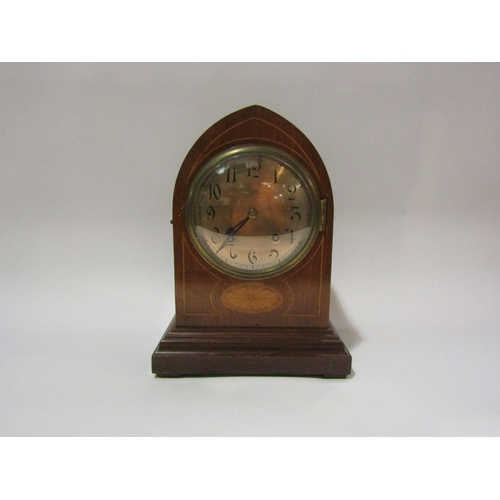 4190 - An Edwardian arch top inlaid mantel clock with silvered dial