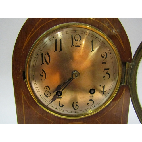 4190 - An Edwardian arch top inlaid mantel clock with silvered dial