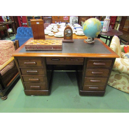 4193 - A Circa 1910 twin pedestal panelled walnut desk with brushing slides over eight drawers and modesty ... 