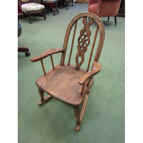 4213 - A country elm seated Windsor hoop and wheel back child's rocking chair