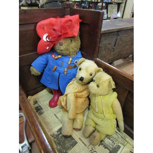 4214 - A Paddington bear soft toy together with two other care worn teddies (3)