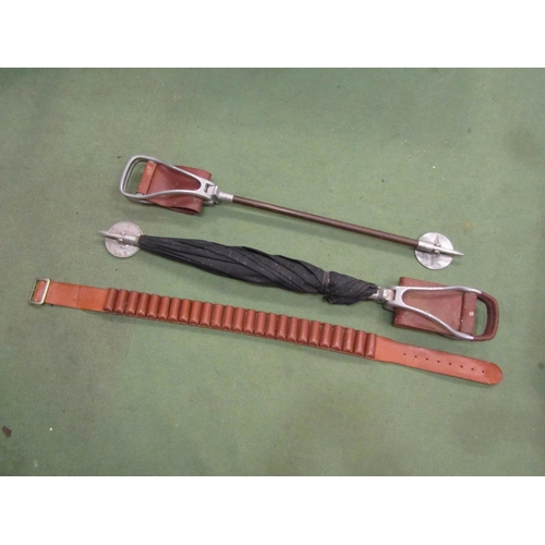 4216 - A leather cartridge belt, shooting stick umbrella and stick