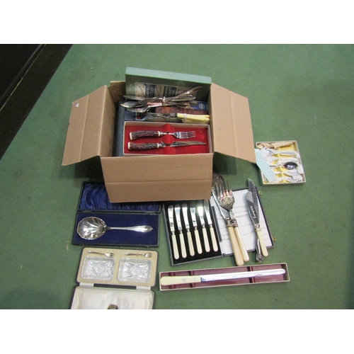 4252 - A box containing a quantity of flatware