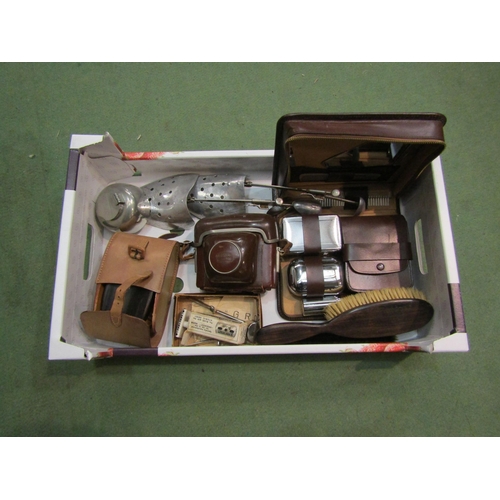 4253 - A box containing mid 20th Century gents toiletry items, shoe stretchers and a Zeiss Ikon camera etc