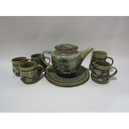 4262 - KATHLEEN ELLEN MARIGOLD AUSTIN (1929-2018): A teapot, four mugs and a cream jug, stoneware painted w... 