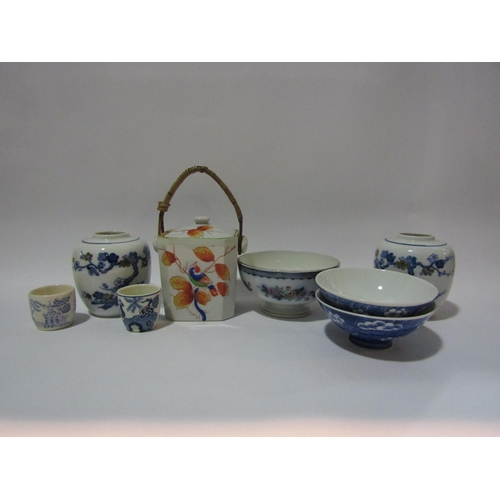 4292 - A quantity of 20th Century Oriental ceramic bowls, lidded cannister with wicker handle, jars minus c... 