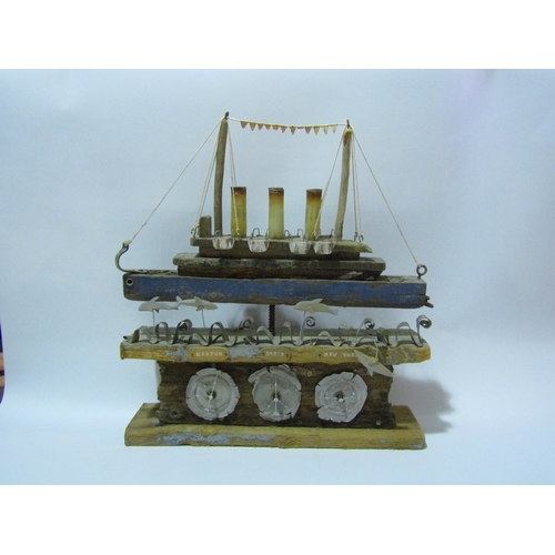 4295 - A rustic driftwood effect model of a steamer boat with clock dials, 46cm tall