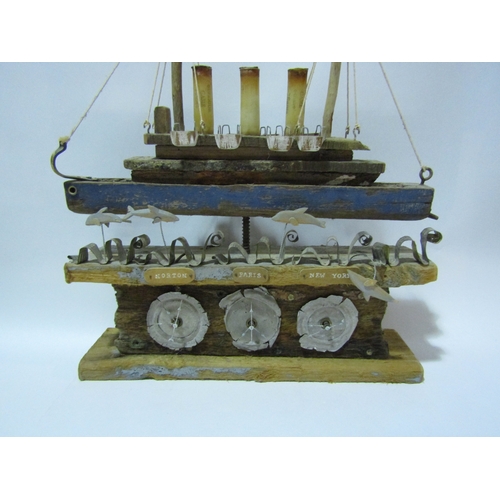 4295 - A rustic driftwood effect model of a steamer boat with clock dials, 46cm tall