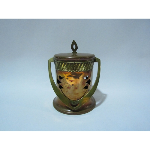 4298 - A copper and brass Art Nouveau cannister with overhead swing handle lozenge to base, stamped GBN (De... 