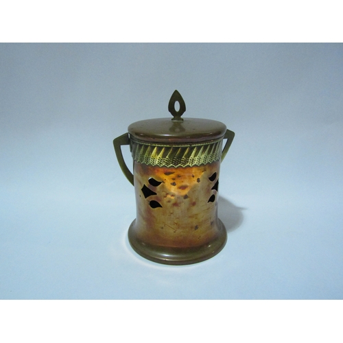 4298 - A copper and brass Art Nouveau cannister with overhead swing handle lozenge to base, stamped GBN (De... 