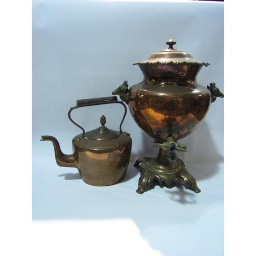 4300 - A copper samovar with animals head handles, 45cm tall, together with a copper kettle